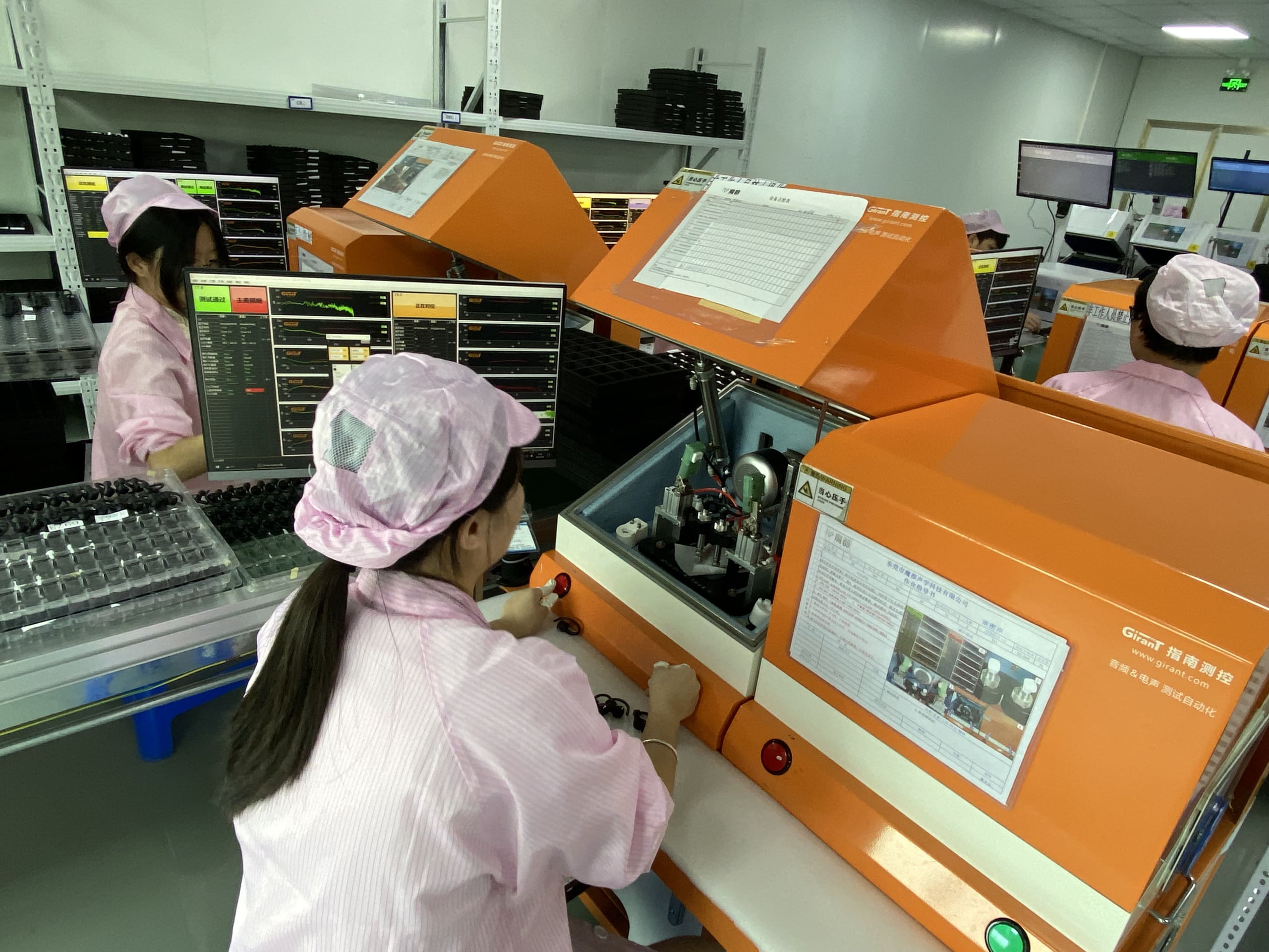 qc staff on production line for tws earphones